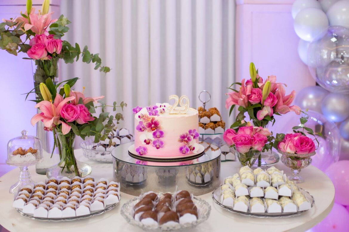 Sophisticated 29th birthday celebration with floral cake decor and sweets.
