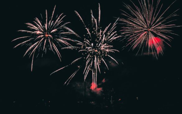 Vibrant fireworks illuminating the night sky with colorful bursts.