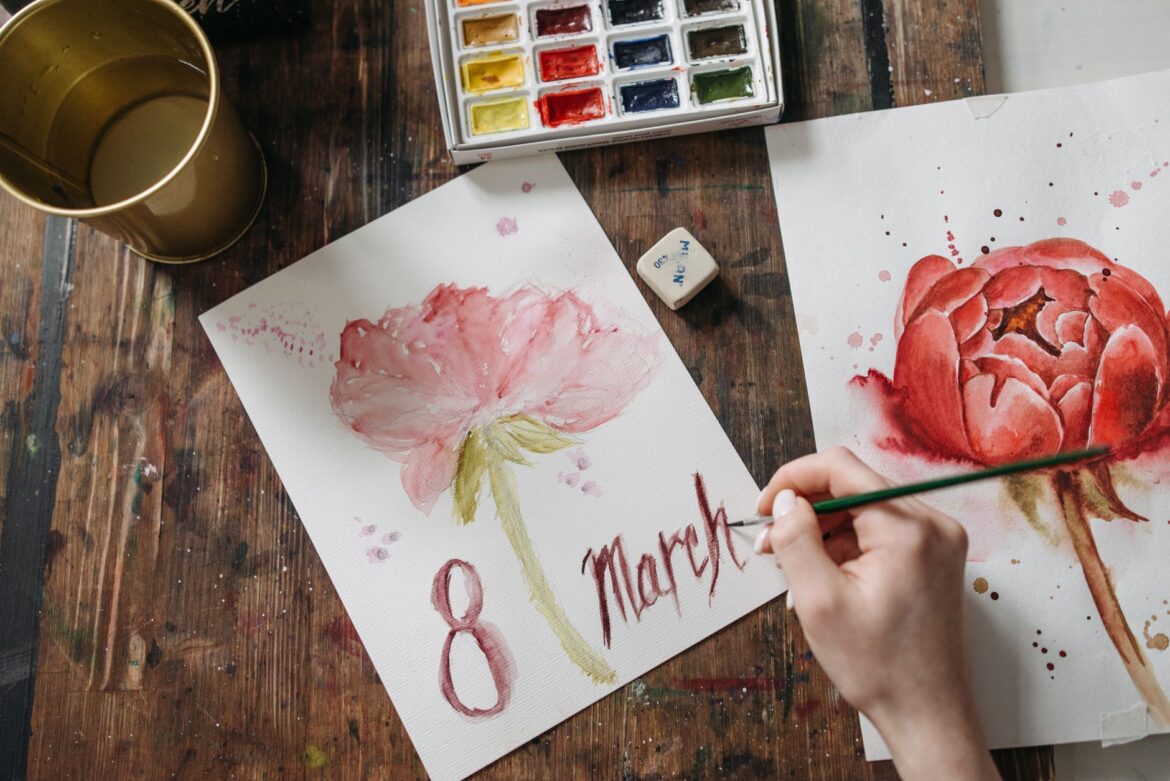 Top view of watercolor floral art featuring Women's Day theme with 8 March date.