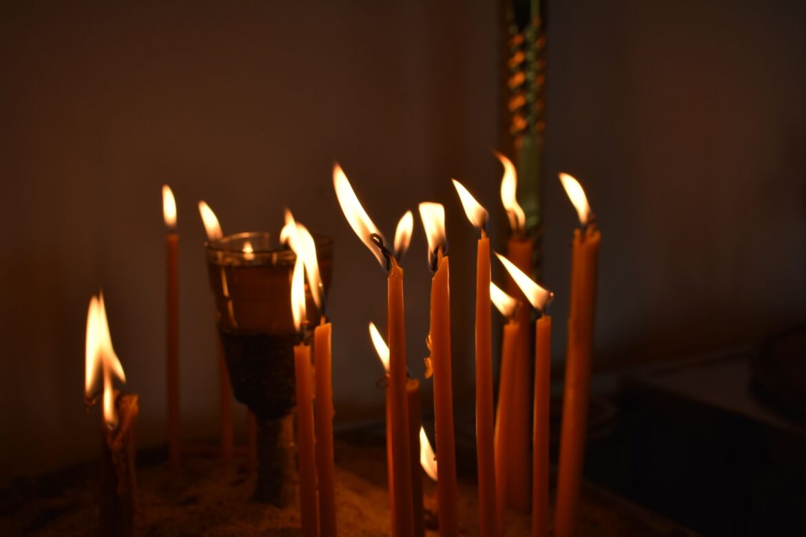 Warm glow of candles creates a serene atmosphere.
