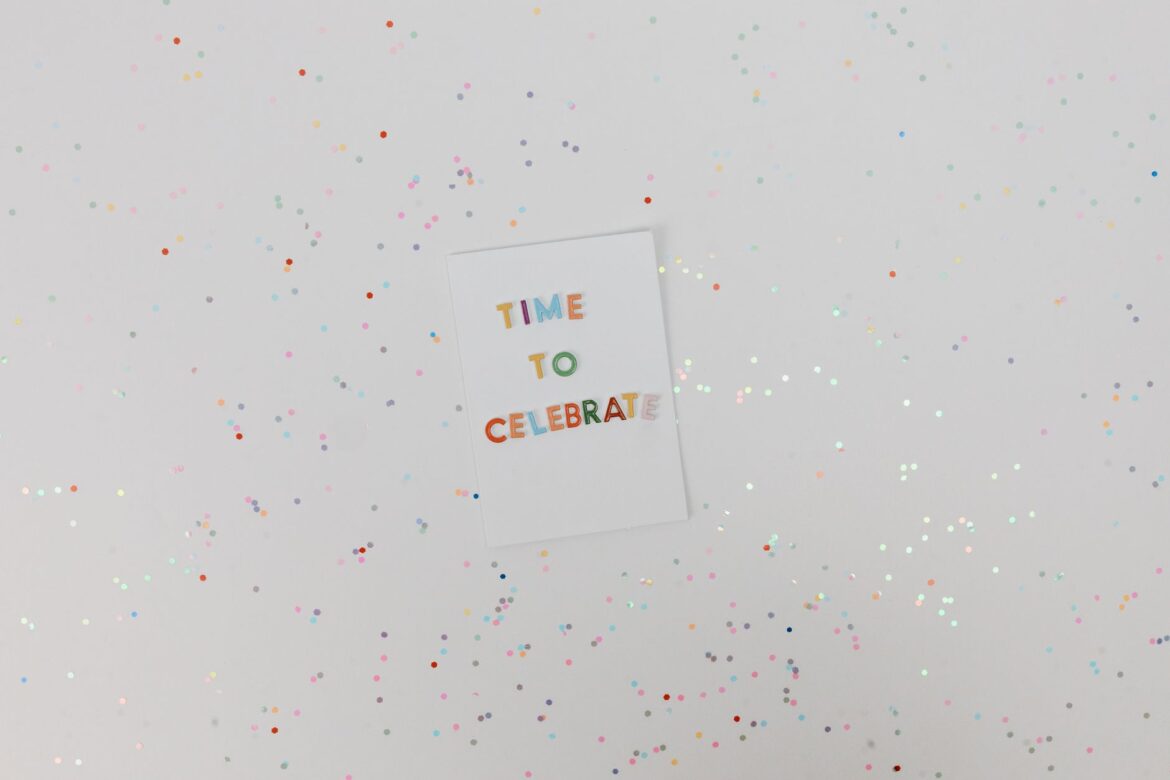 Colorful celebration card with confetti on a white background. Perfect for festive occasions.