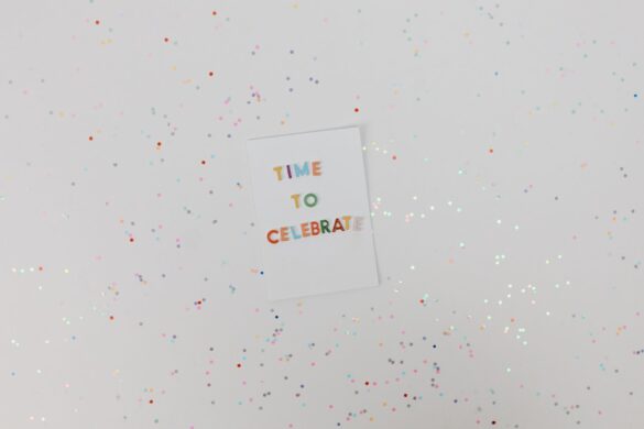 Colorful celebration card with confetti on a white background. Perfect for festive occasions.
