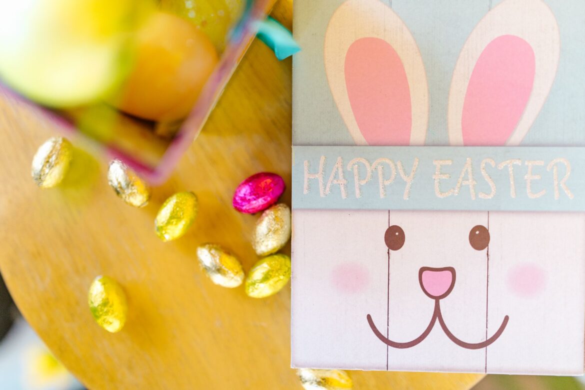 Bright Easter-themed decor featuring a bunny and colorful foil-wrapped eggs.